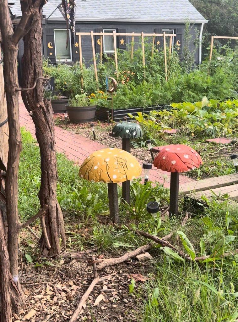 DIY garden mushrooms installed in a whimsical garden